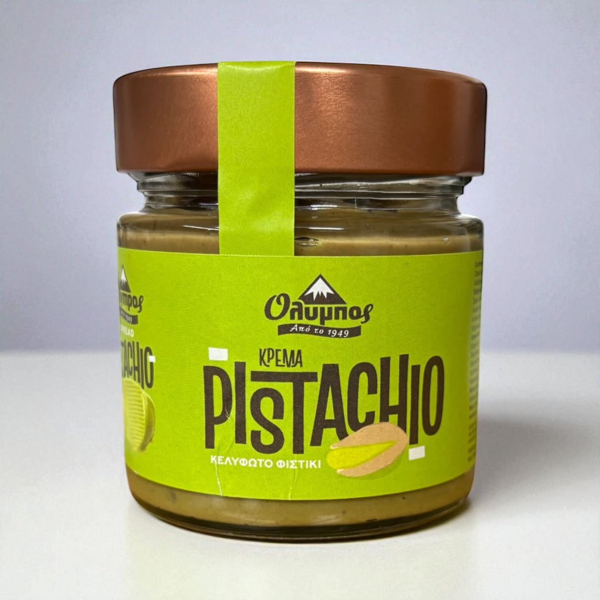 Jar of pistachio cream with a green label on a white background