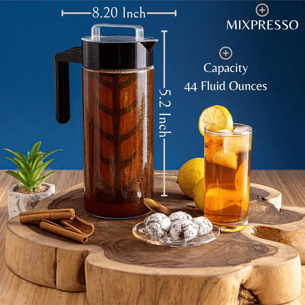 MIXPRESSO iced coffee maker with dimensions and a glass of iced tea on a wooden surface.