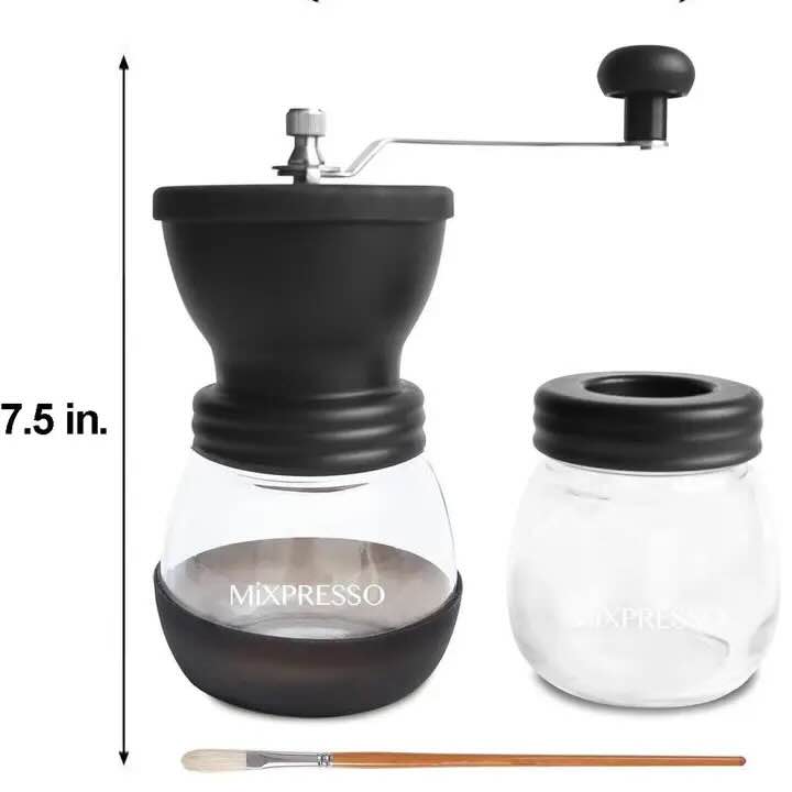 Manual coffee grinder set with a black hand-crank top, clear glass bean hopper labeled 'MIXPRESSO', a second empty glass jar with a black lid, and a small cleaning brush, shown on a white background with a 7.5 in.