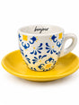Bonjour espresso cup with blue and yellow floral pattern on a bright yellow saucer, front view