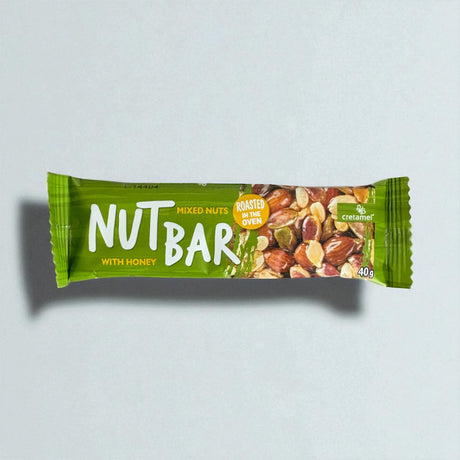Nut bar packaging with green label on a light gray background