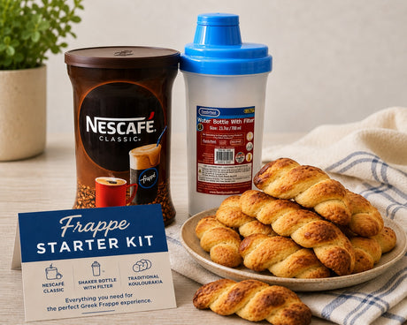Greek Frappé Starter Kit with NESCAFÉ Classic coffee, shaker bottle with filter, and traditional Greek koulourakia cookies on a kitchen table.