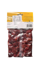 Bag of dried kalamata olives with a yellow label on a white background