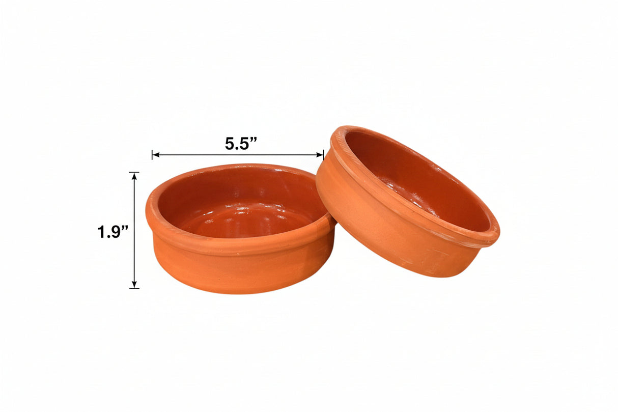 Two terracotta pots on a white background