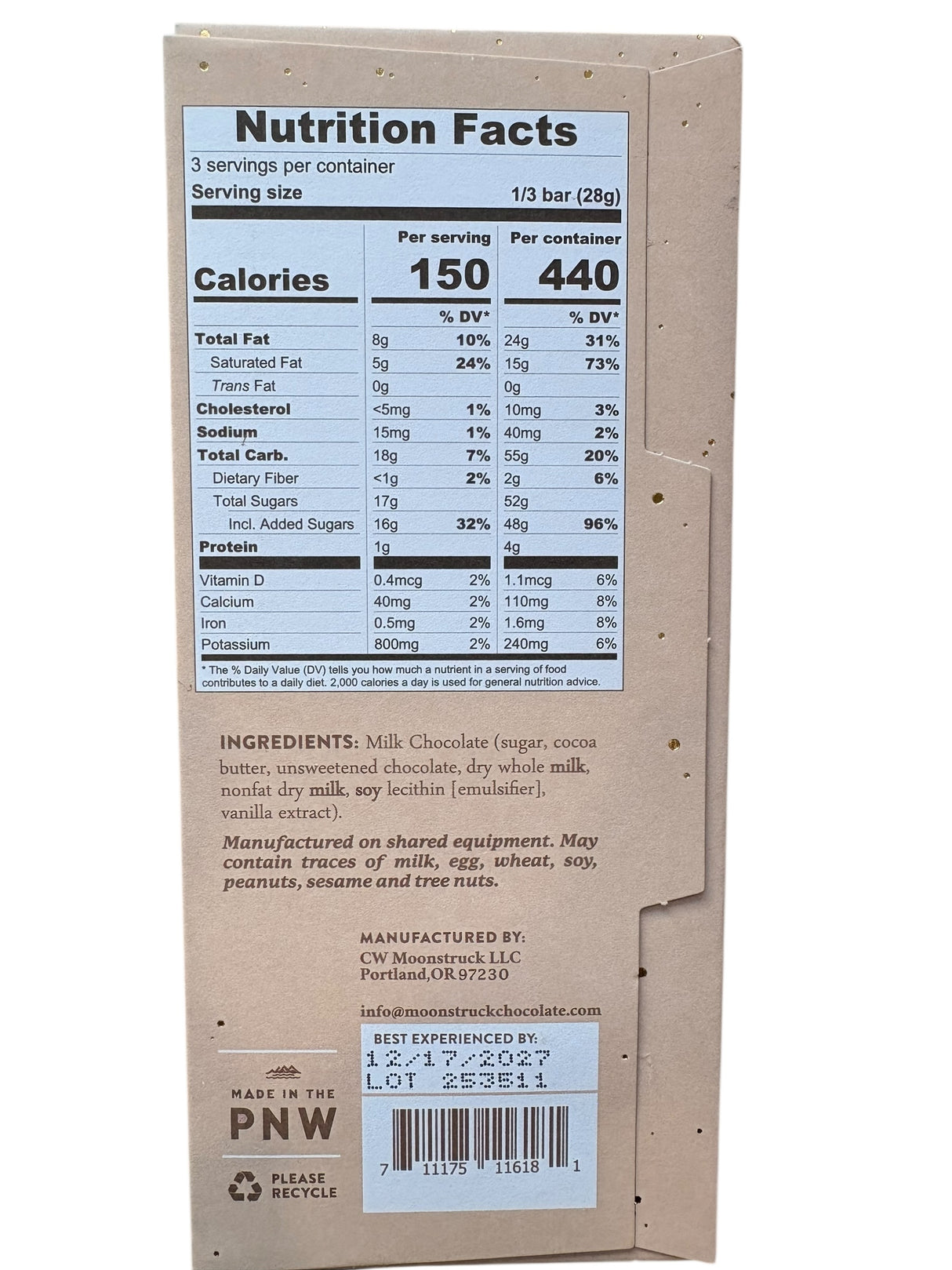Nutrition facts label on a chocolate bar packaging with ingredients listed below.