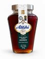 Front of Attiki Dark Brown Forest Honey jar, raw Greek honey, 16 ounces